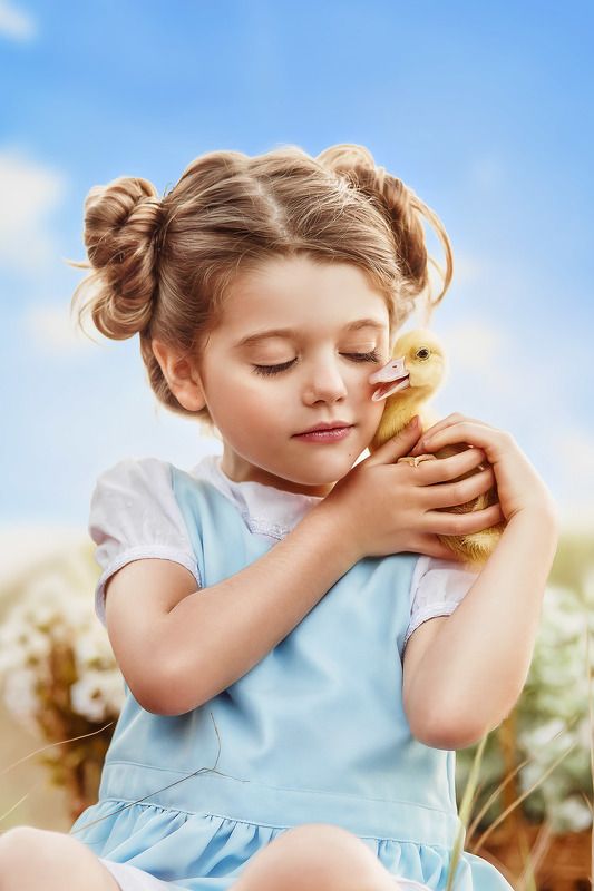 Little girl with duckling 