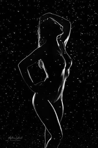 nude silhouette in the night rain