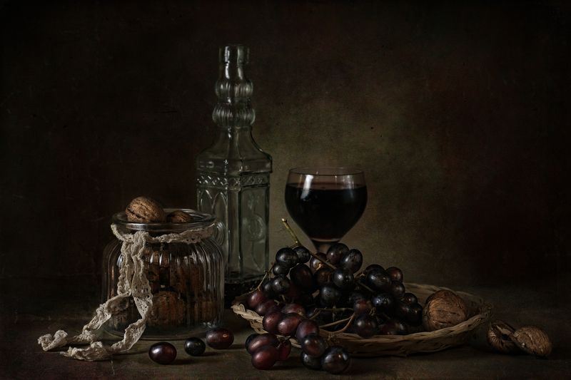 still life with a glass of wine and grapes, walnuts