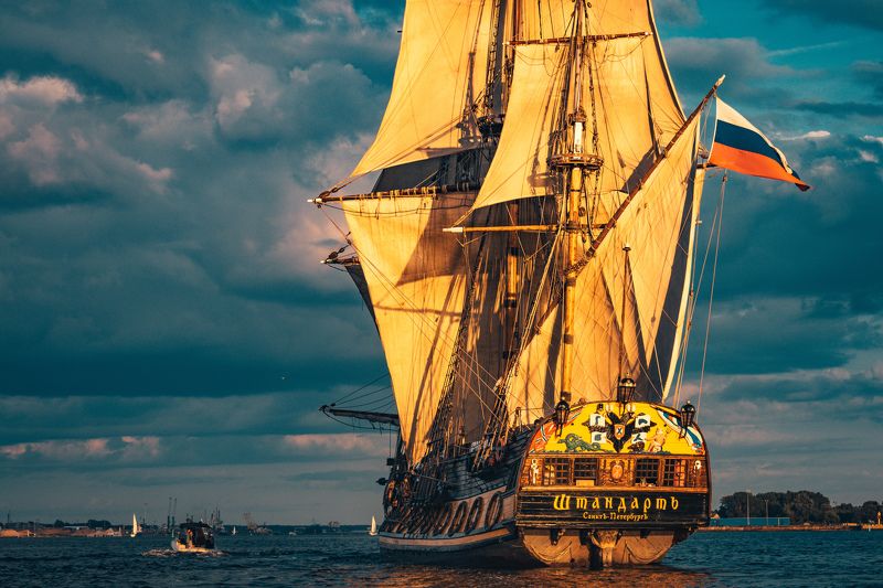 frigate, sea, sail, transportation, boat, ship, cruise, vessel, sailboat, historic, nautical, navigation, water, wooden, voyage, vintage, tall, sky, old, navy, wind, travel, maritime, galleon, transport, ancient, adventure, yacht, wave, marine, mast, anti The Frigate Shtandar in calm weather sailing sunset time Riga Latviaphoto preview