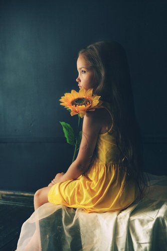 Kid with sunflower