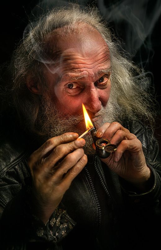 Pipe smoking old man
