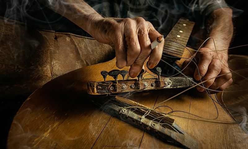 Hands and broken guitar IV.