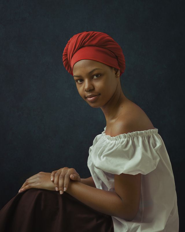Портрет африканской девушки в красном тюрбане