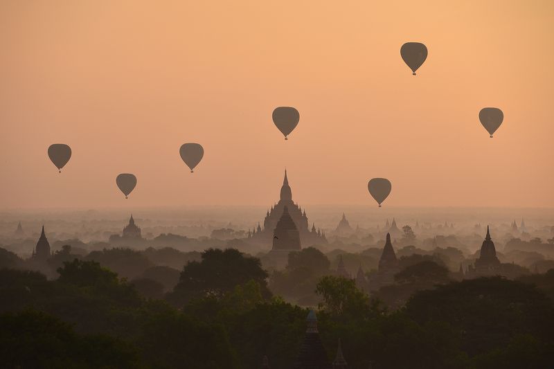 Weather Architecture Bagan Buddhism Built Structure Color Image Flying Fog Horizontal Hot Air Balloon Mid-Air Mode of Transport Mountain Myanmar Nature No People Outdoors Pagoda Photography Silhouette Sky Sunrise - Dawn Temple - Building Transportation Tr Golden Kingdomphoto preview
