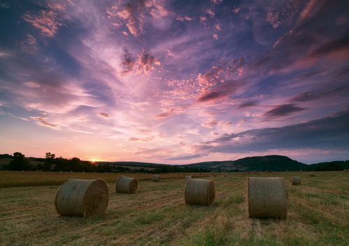 Sunset at the hay bales field