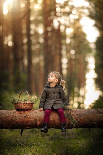 Little girl in a magical forest