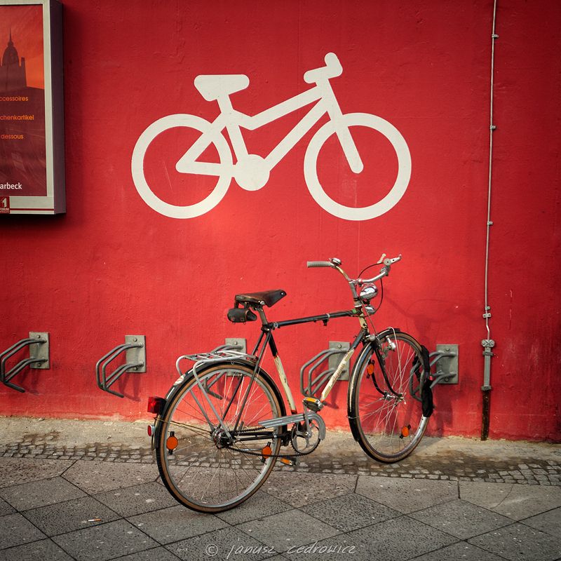 berlin, germany,street,city,sidewalk,parking,bike,bicycle,cycling,urban,traffic,sign,wall,painting,fuji two bicyclesphoto preview