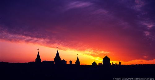 medieval castle or stronghold silhouette and beautiful sunset. Tourism in Europe Fuji velvia, expired in 2004